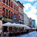 Colorful street scene in Belfast with historic buildings. Best Things To do In Belfast